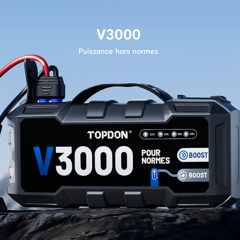 Démarreur portable Topdon V3000 avec câbles pinces, posé sur un rocher, en montagne – vue produit